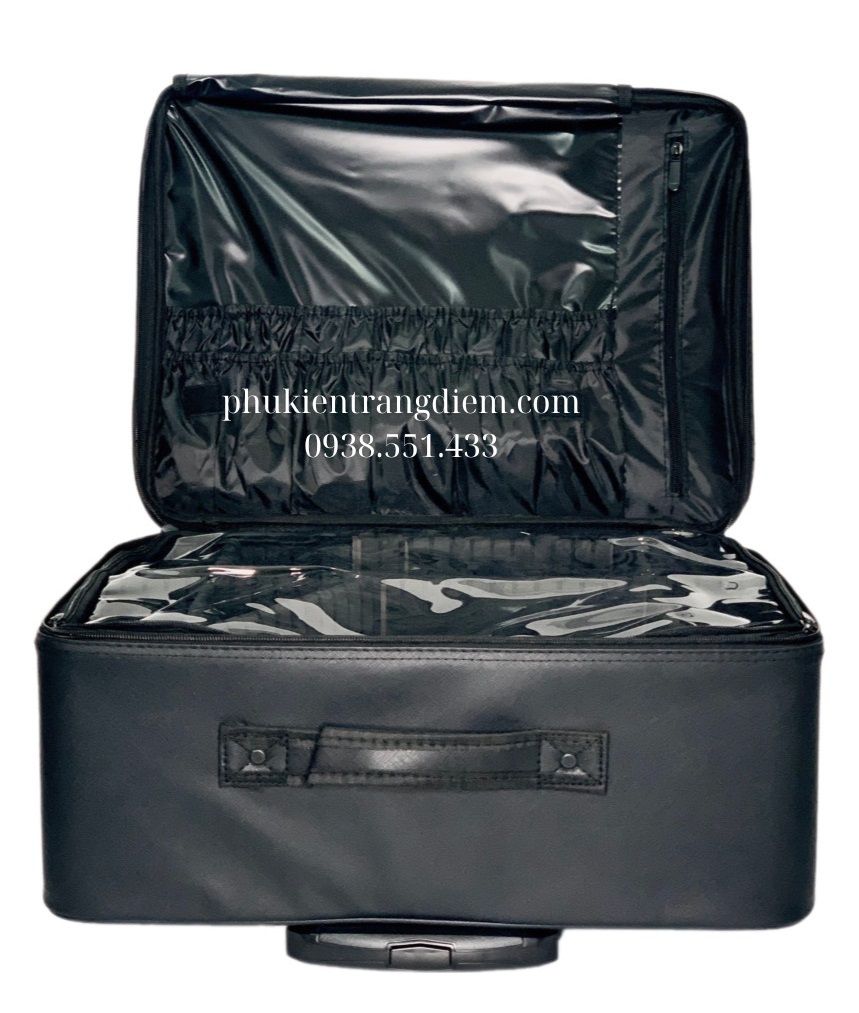 cốp đựng đồ trang điểm size trung bình có bánh xe kéo vỏ da màu đen